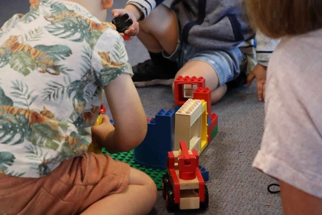 Two children playing with Duplo blocks at early childhood centre.