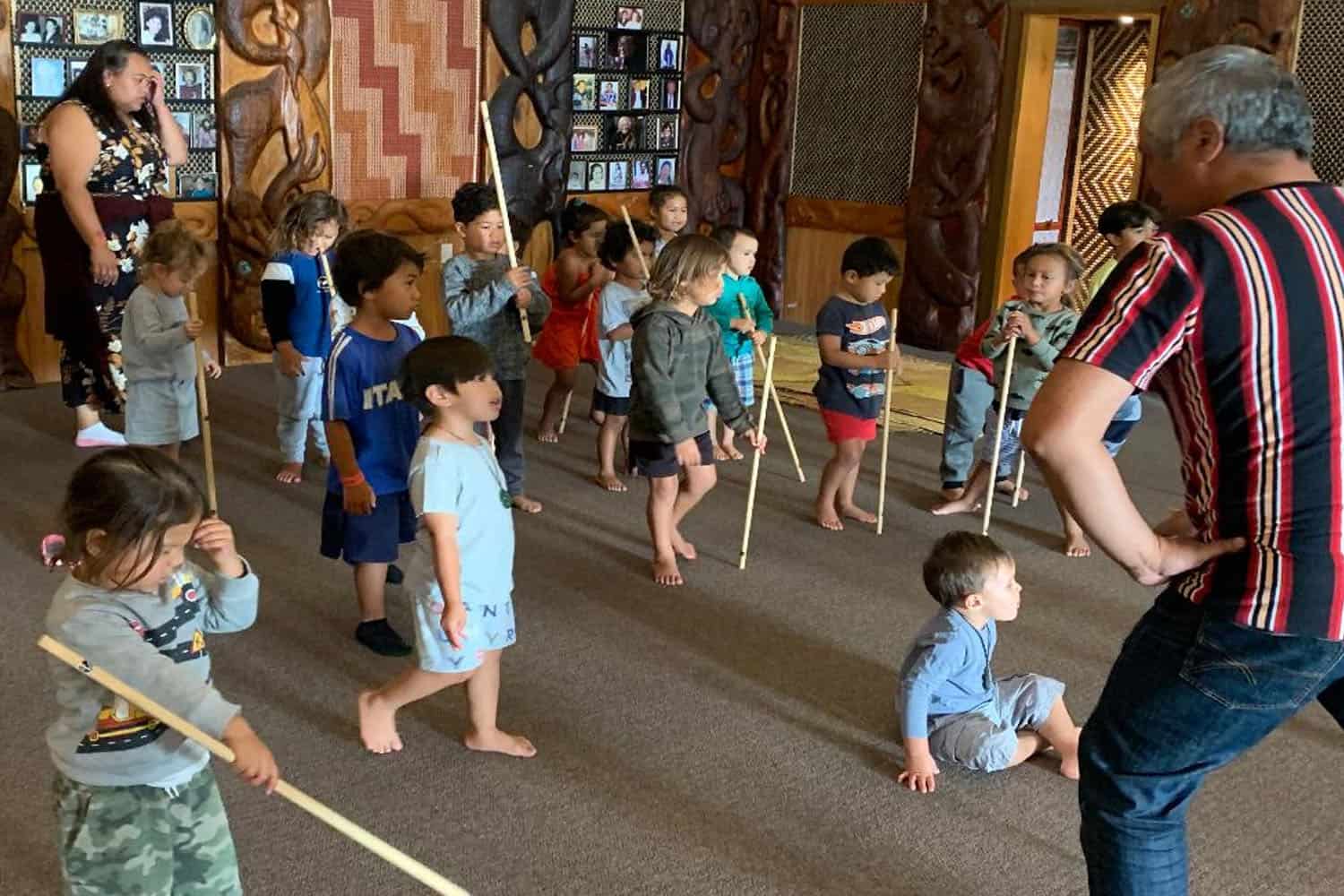 Children supported in their Maori cultural development - learning a haka.