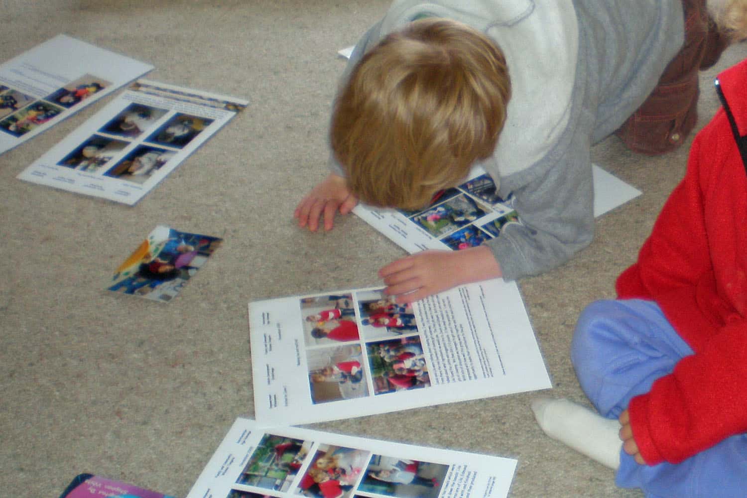children looking at their assessment portfolios