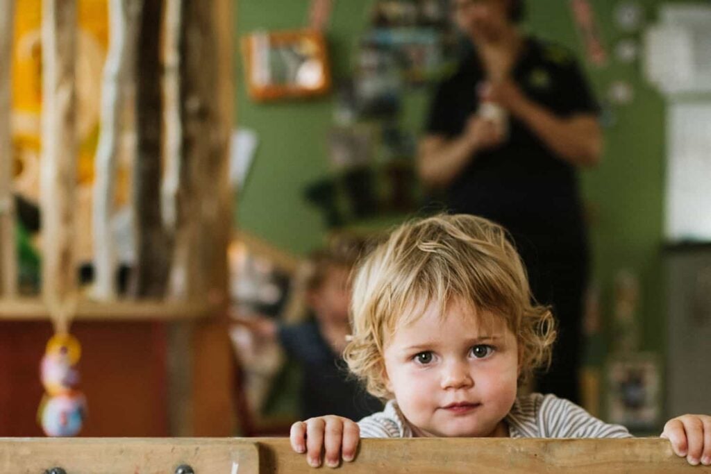 Child looking over gate