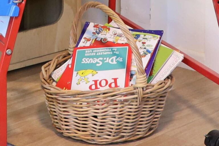 A basket of children's books for children to carry to any place they want at their early childhood centre